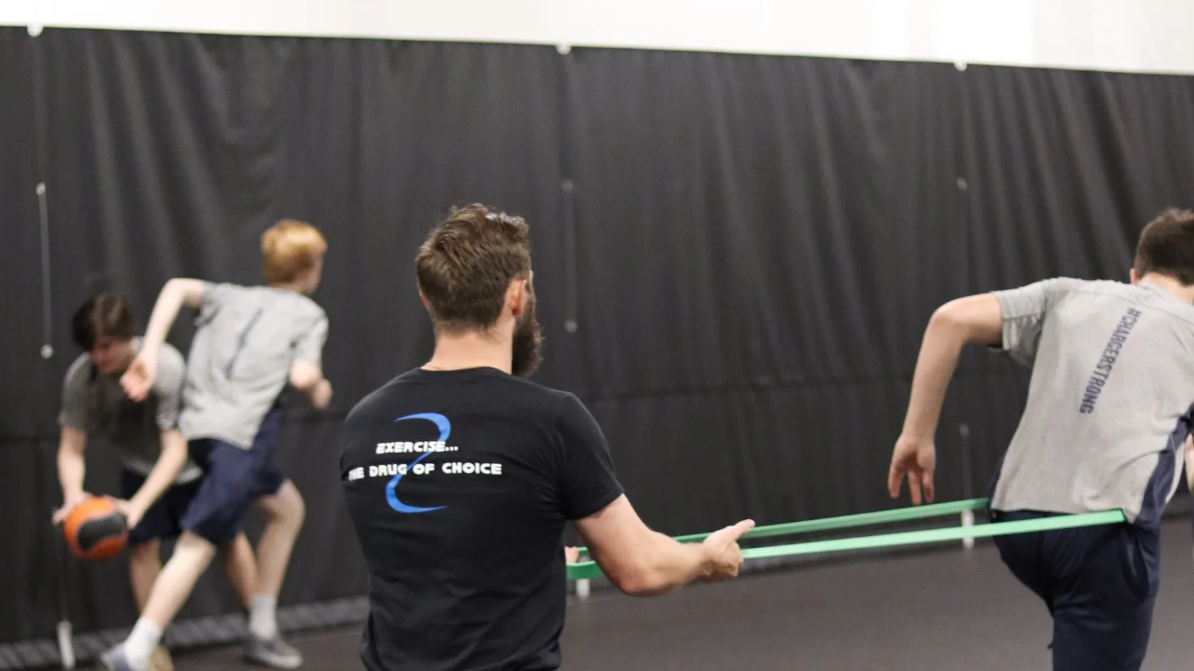 Garrett coaching an athlete one-on-one at the GPS facility
